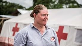 Amanda McClellan in front of the Red Cross tents
