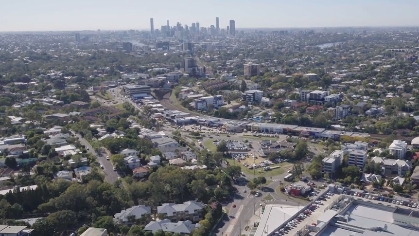 A drone video of a large roundabout with a car sales yard in the centre