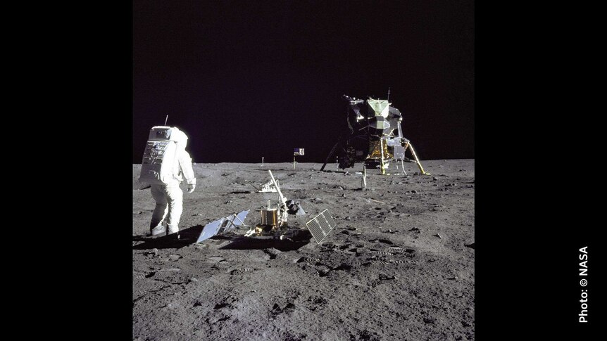 Apollo 11 lunar lander and astronaut on the moon