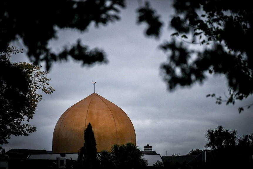 A memorial on Deans Avenue in Christchurch for the shooting victims looks over one of the scenes of the massacre.