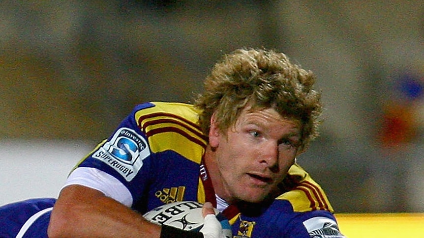 Decorated career ... Adam Thomson scores a try for the Highlanders in 2011
