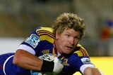 Decorated career ... Adam Thomson scores a try for the Highlanders in 2011