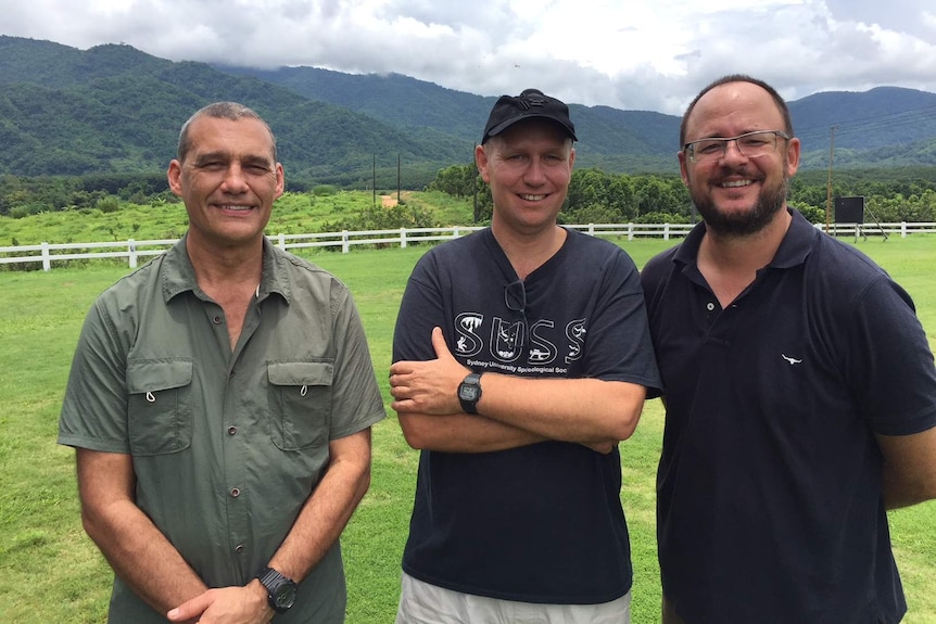 Head shot of three men standing together in Thailand.