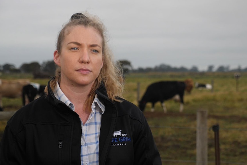 Greenham livestock supply chain manager Jessica Loughland stands in front of a paddock in Victoria.