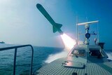 Speedboat with missile firing off back