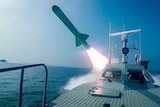 Speedboat with missile firing off back
