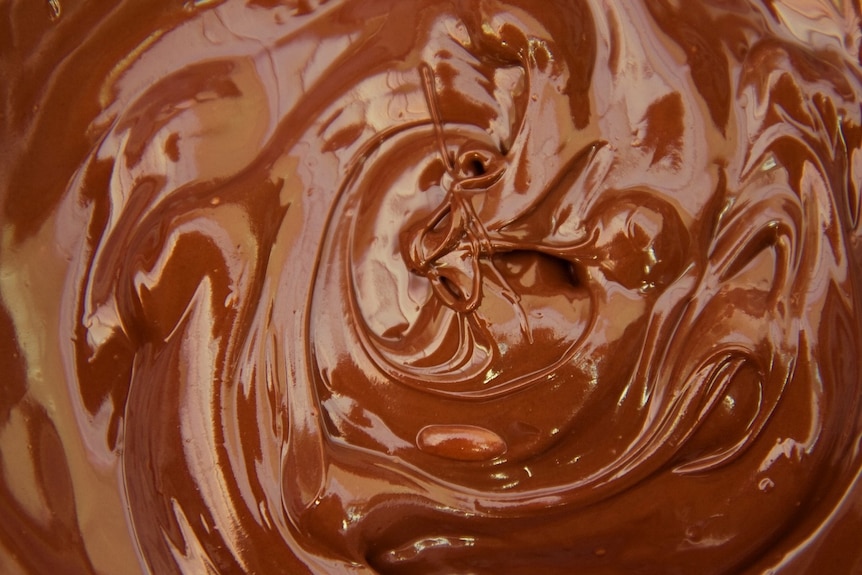Brown, shiny melted chocolate