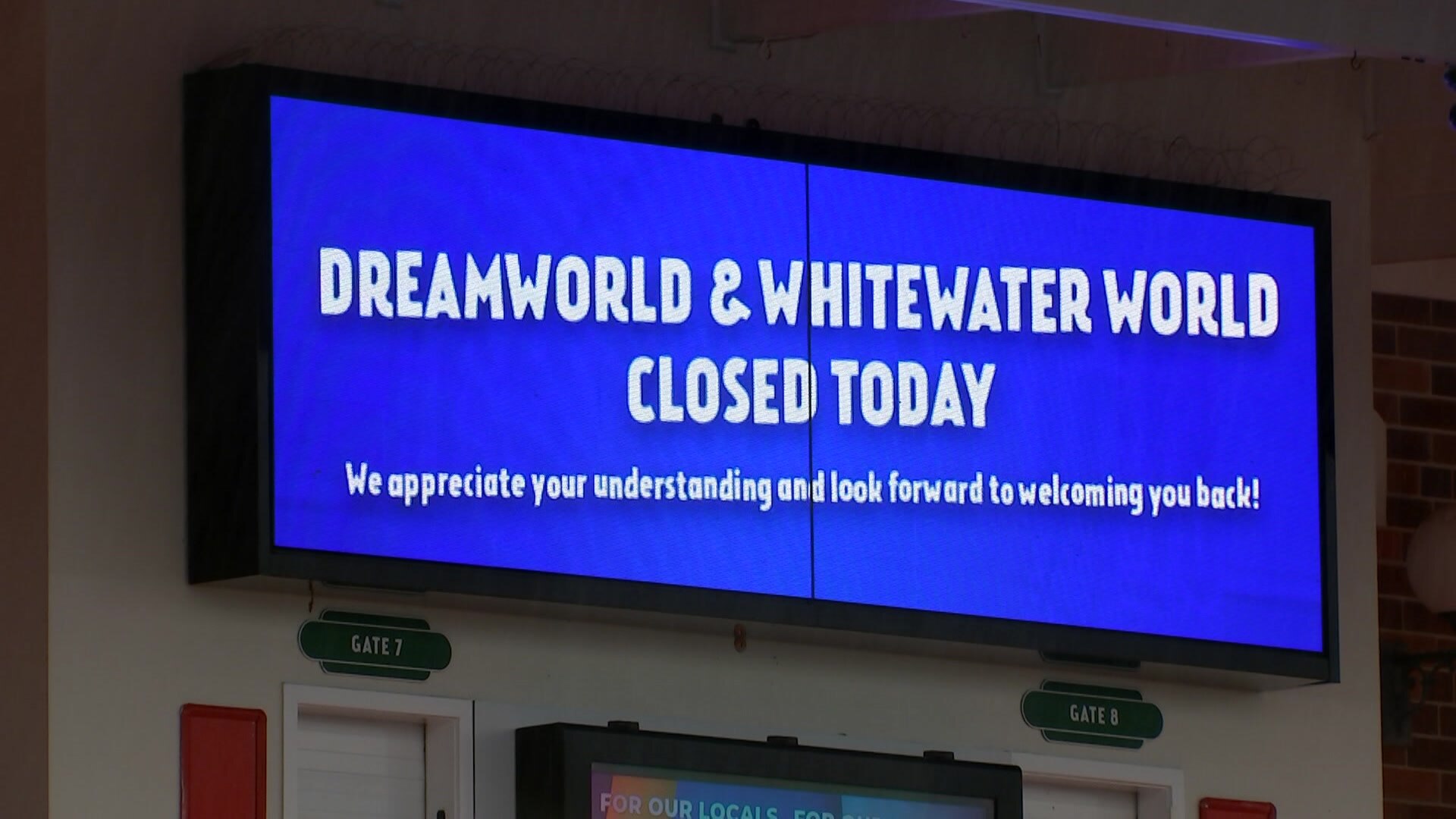 A sign says Dreamworld and White Water World are closed