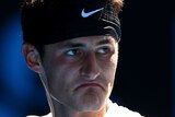 Bernard Tomic came back from almost certain defeat after surrendering the second-set tie-break.