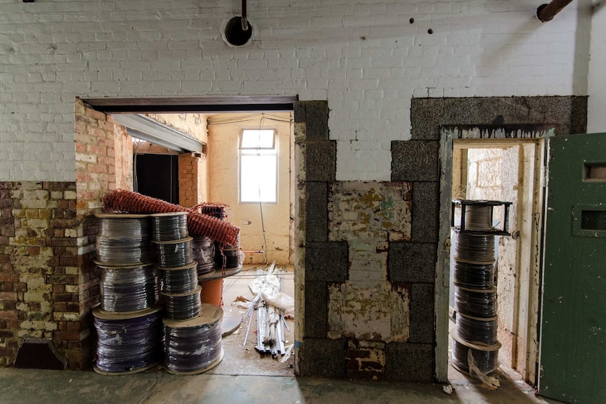 Cells in the Marong wing with walls between them knocked out to form space for the new box office and cloakroom