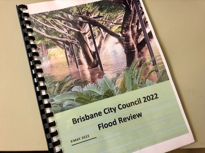 A spiral bound report with an image of a flooded park on the cover. 