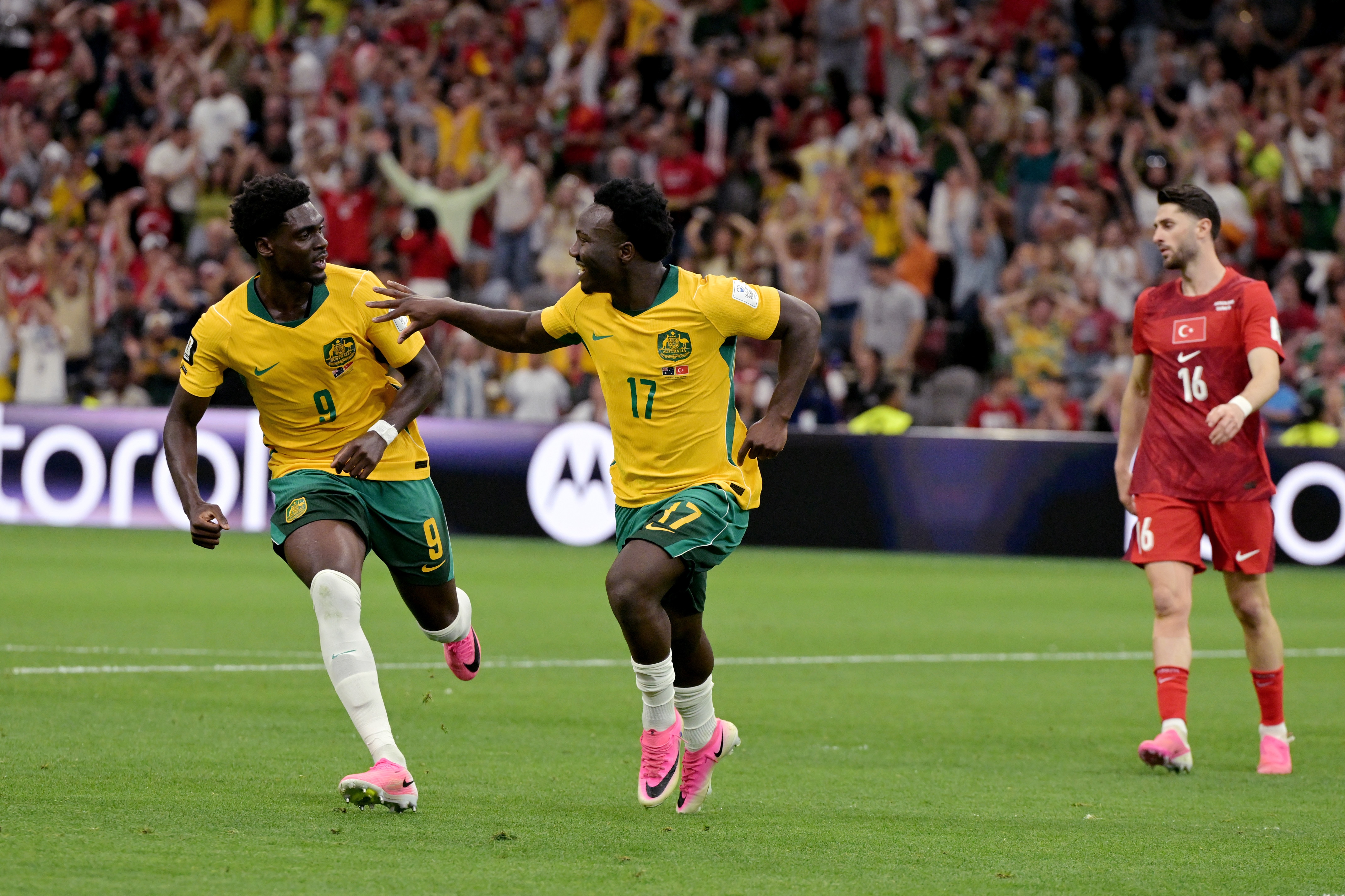 Nestory Irankunda of Australia celebrates 1-0 with Mohamed Toure