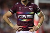A Manly Sea Eagles jersey with rainbow bands above and below the sponsor name and on the cuffs and collar