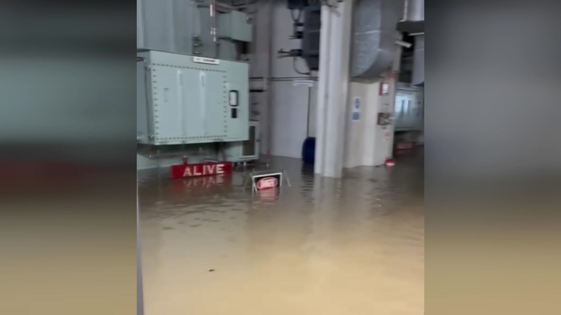 Underground facility flooded with murky water.