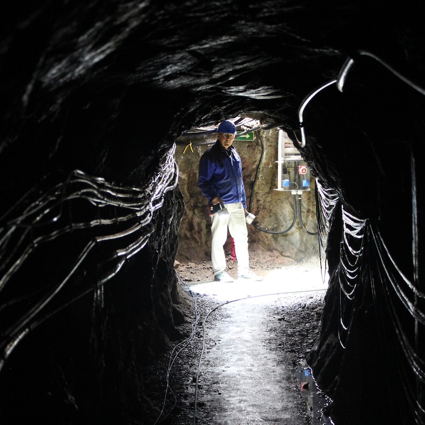 Seismologist Rudolf Widmer-Schnidrig walking through the narrow tunnels of the underground Black Forest Observatory