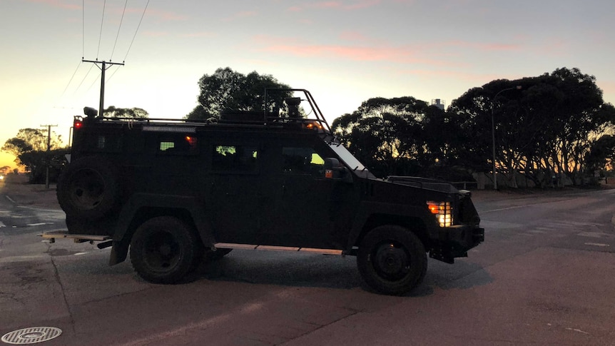 A BearCat armoured police vehicle in early morning light.