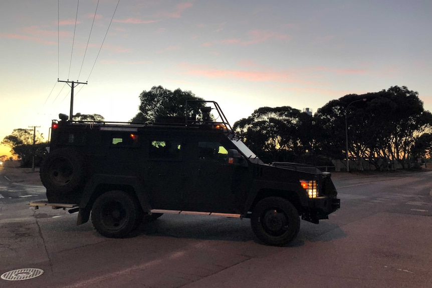 A BearCat armoured police vehicle in early morning light.