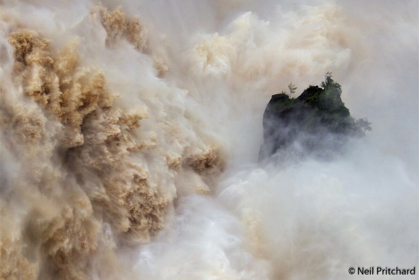 Water cascades over the Barron Falls in Queensland.