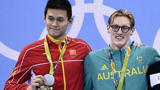 China's Sun Yang holds his silver medal next to gold medal winning swimmer Mack Horton from Australia.