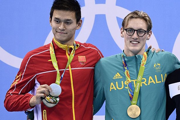 China's Sun Yang holds his silver medal next to gold medal winning swimmer Mack Horton from Australia.