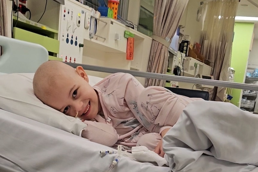 child with cancer in hospital bed