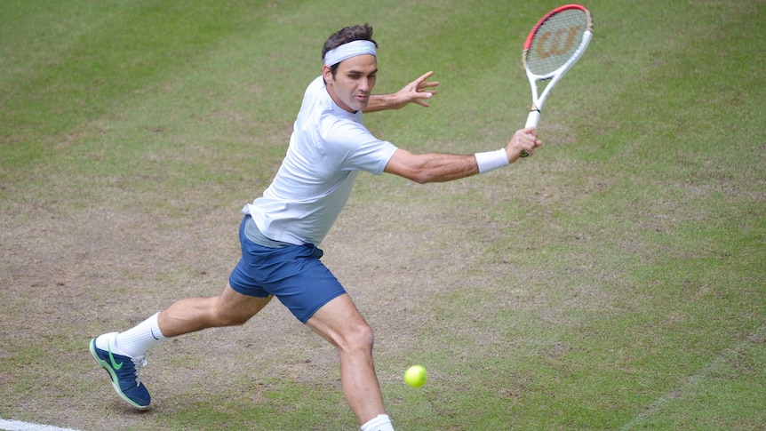Switzerland's Roger Federer plays a backhand in his quarter-final match against Mischa Zverev.