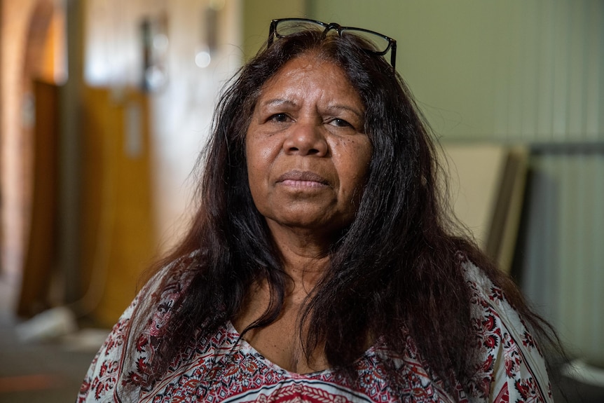An Aboriginal woman with a concerned expression on her face