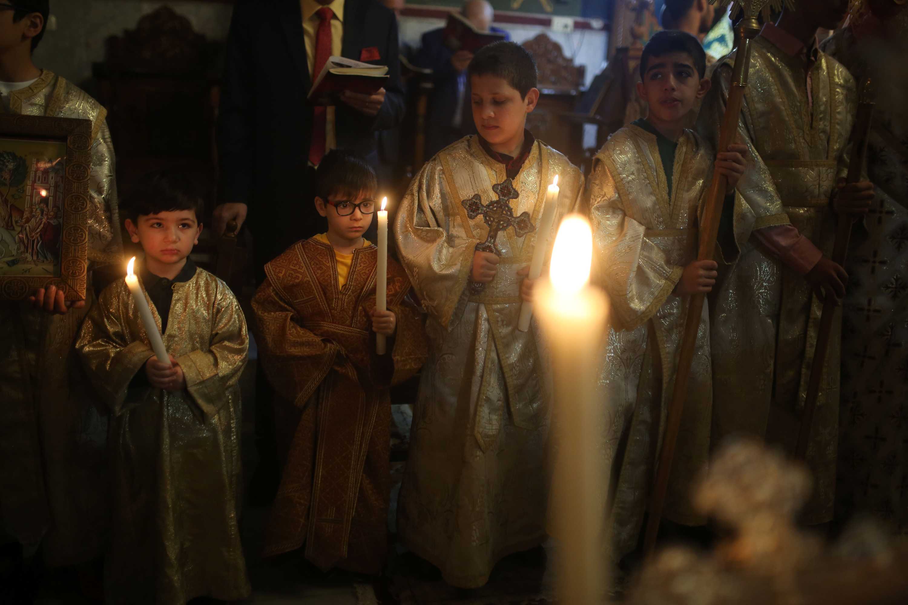 Palestinian Christians take part in celebrations at a Greek Orthodox church in Gaza City.