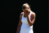 Down and out... Jelena Dokic struggled with illness and fitness during a tough 3-6, 7-5, 6-2 defeat.