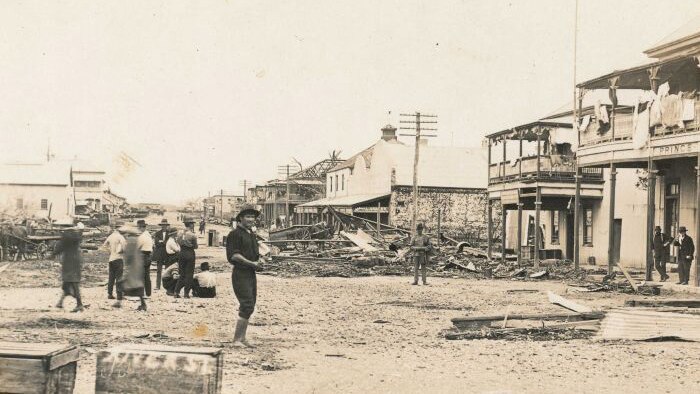 Black and white photo of residents surveying the damage in Mackay in north Qld after a cyclone in January 1918.