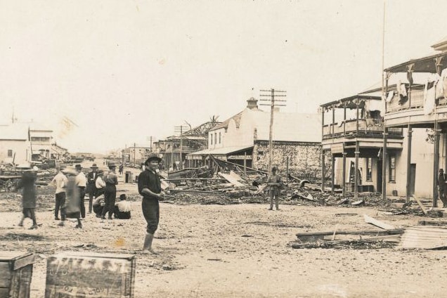 Black and white photo of residents surveying the damage in Mackay in north Qld after a cyclone in January 1918.