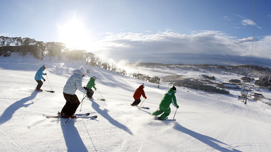 Skiers in Snowy Mountains