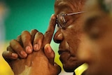 President Jacob Zuma rests his head in his hands as he attends the African National Congress elective conference