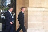 Colin Munn (R) outside court with his lawyer
