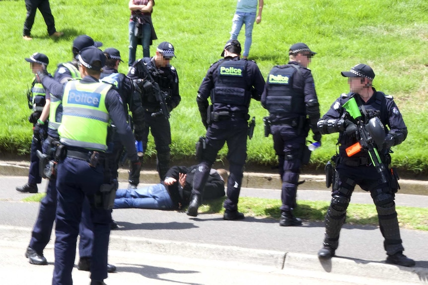 Victorian police subdue a man at St Kilda demonstrations