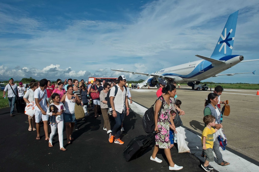 Tourists board airlifts to escape flooded Acapulco after deadly storms ...