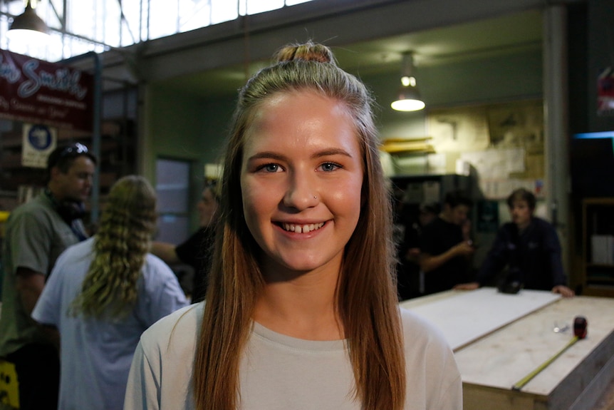 Portrait photograph of woodwork student Sarah Martin in a workshop at Lake Ginninderra College, Canberra.