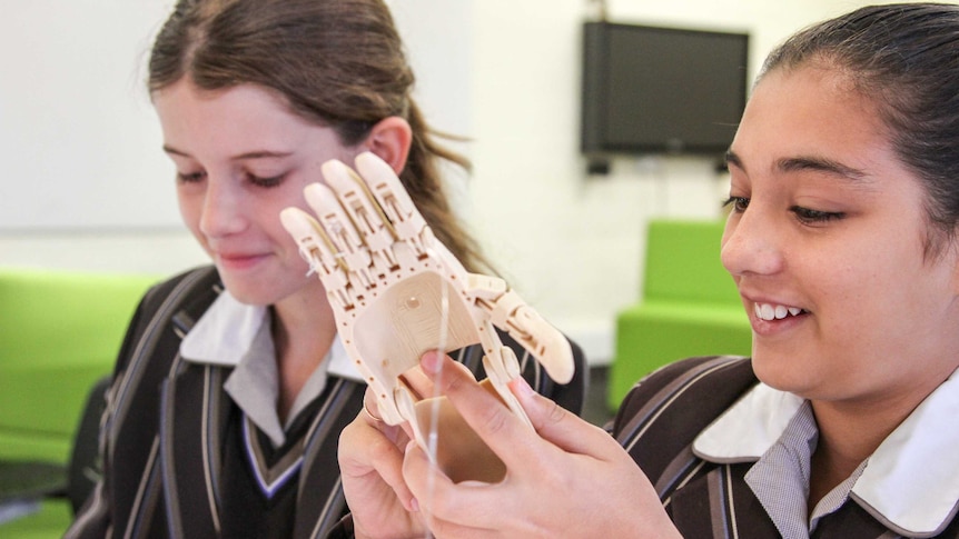 Year 7 students with their prosthetic hand.