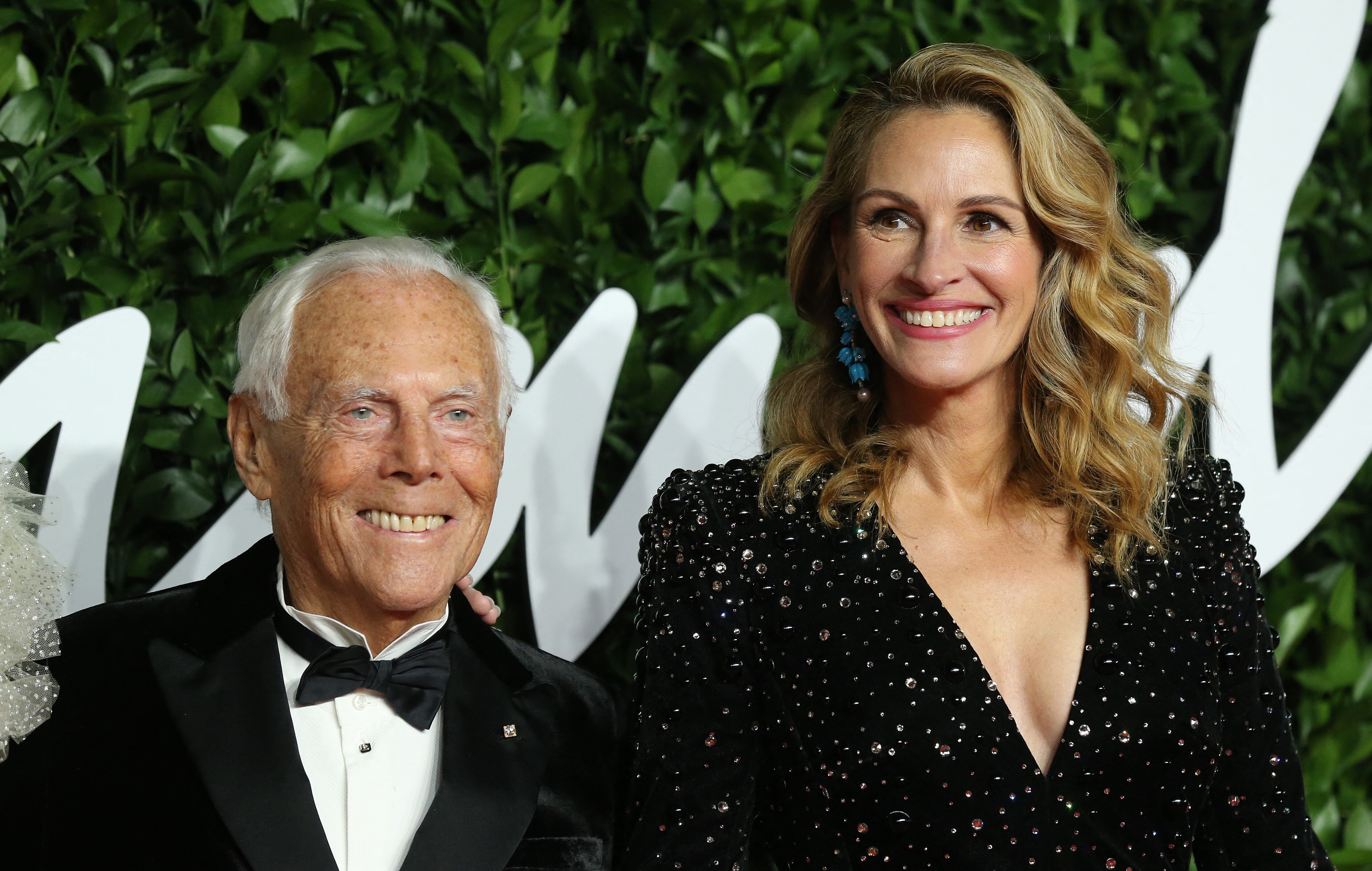 Giorgio Armani standing next to Julia Roberts on the Red Carpet.