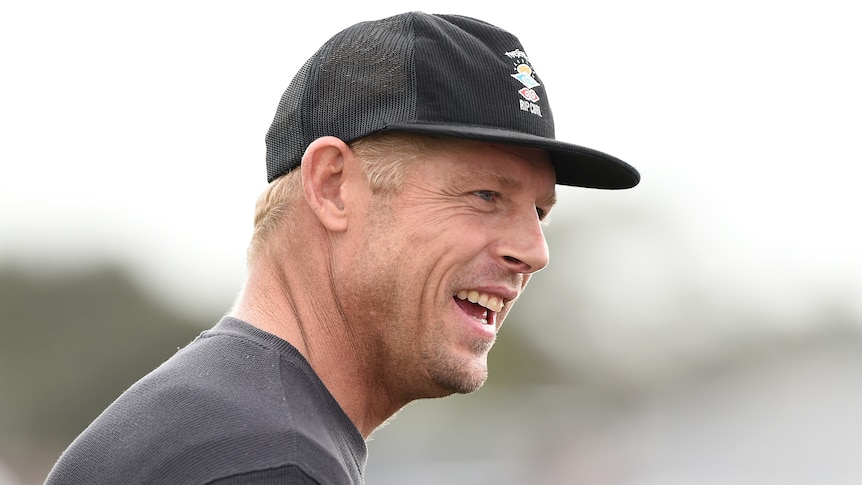 Mick Fanning smiles as he looks to his right at a media conference on the Gold Coast in 2021.