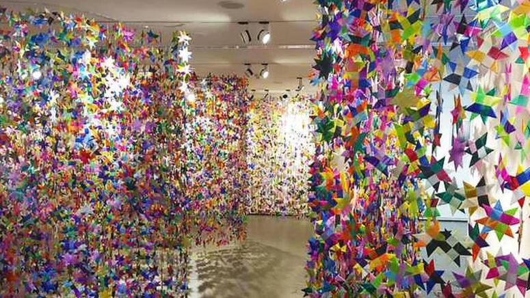 Thousands of ribbon stars hang on display