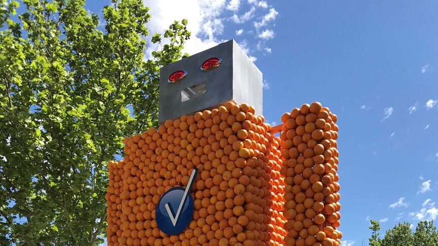 Talking robot orange sculpture at Griffith Spring Fest