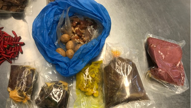 Plastic bags filled with uncooked pork, eggs and other foods illegally brought into Australia in a traveller's luggage.