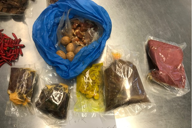 Plastic bags filled with uncooked pork, eggs and other foods illegally brought into Australia in a traveller's luggage.