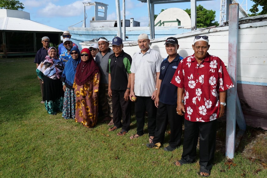 A group of Cocos Malay elders gathered on Home Island near the waterfront. 