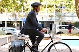 Shane Rattenbury on his bicycle in Civic.