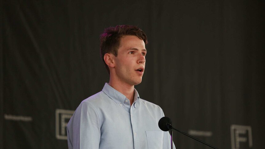 Henry Dow speaks to the vigil at Federation Square