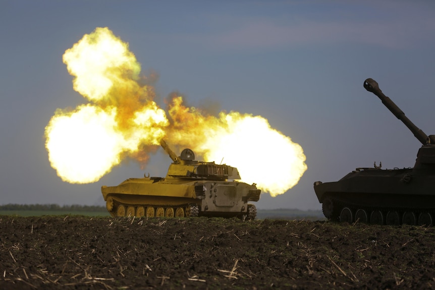 View of flames above a tank.