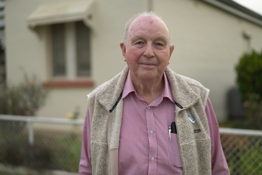 Man wearing a pink shirt.