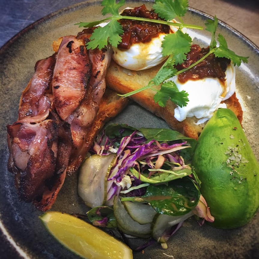 View from above of plates containing smashed avocado on toast